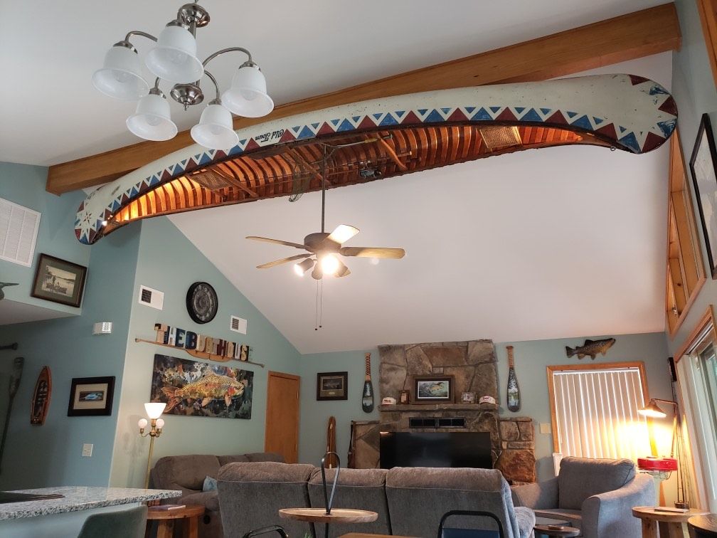 Vintage canoe displayed above The Boathouse living room